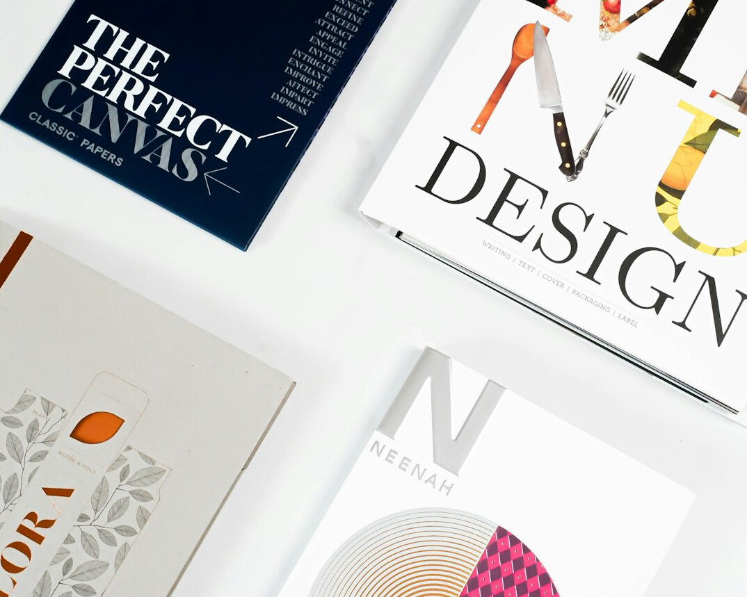 Magazine layout spread on a design desk