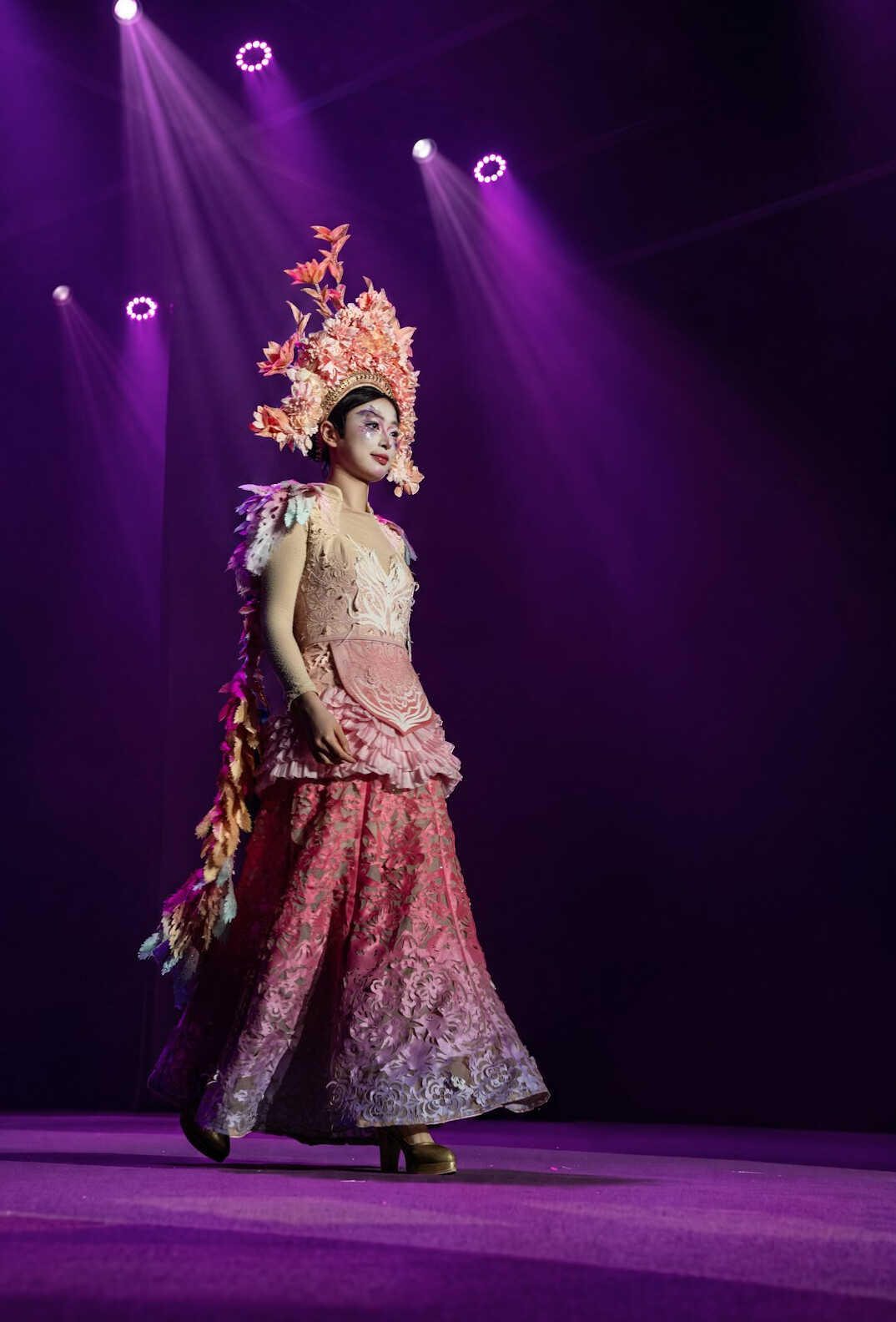 Fashion model walking on a runway during a show