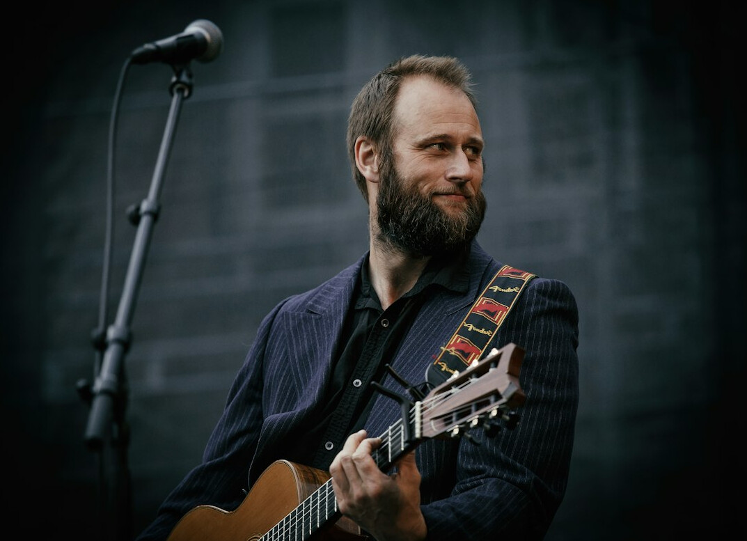 folk musician with guitar